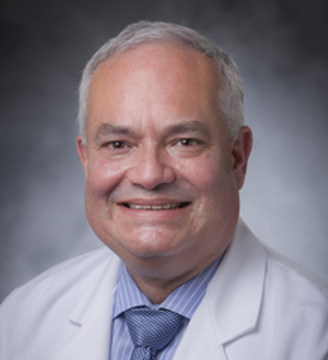 Dr. Quinones in white lab coat