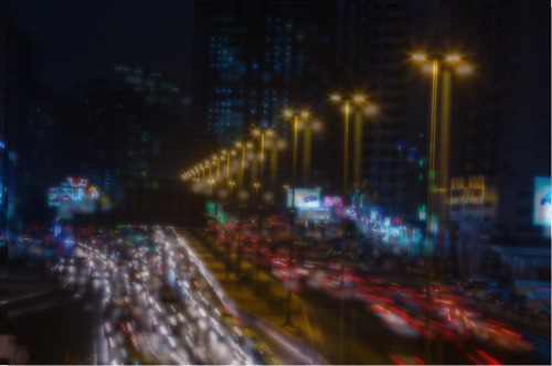 Image of highway at night with lights ghosted and doubled